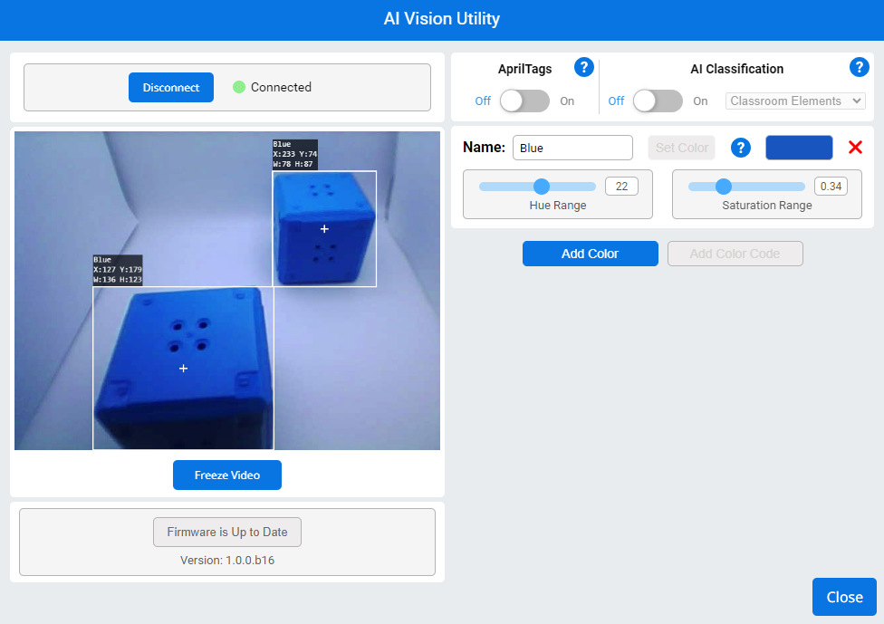 อินเทอร์เฟซ AI Vision Utility ตรวจพบลูกบาศก์สีน้ำเงินสองลูกทางด้านซ้าย ระบบมีการเชื่อมต่อโดยเปิดใช้งาน AprilTags และปิด AI Classification อินเทอร์เฟซจะแสดงการตั้งค่าสำหรับการตรวจจับสีน้ำเงิน โดยตั้งค่าเฉดสีเป็น 22 และความอิ่มตัวเป็น 0.34 มีปุ่มสำหรับหยุดวิดีโอ และเพิ่มหรือตั้งค่าสี เฟิร์มแวร์ระบุว่าเป็นเวอร์ชันล่าสุดแล้ว ใช้เวอร์ชัน 1.0.0.b16 นอกจากนี้ยังมีปุ่มสำหรับตัดการเชื่อมต่อหรือปิดยูทิลิตี้อีกด้วย