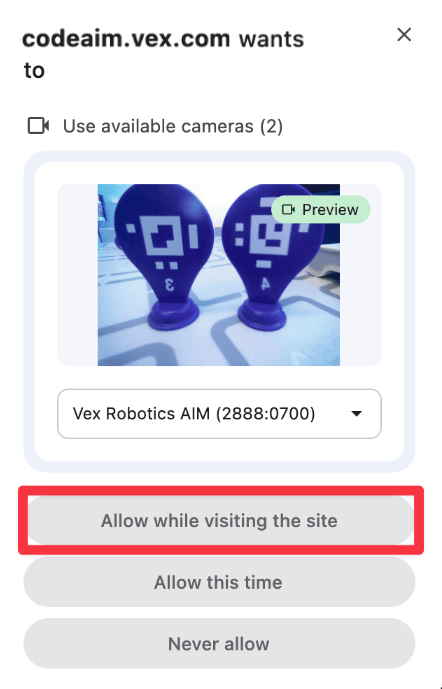 The macOS permission dialog in the AI Vision Utility in VEXcode AIM. The button reading Allow while visiting the site is highlighted.