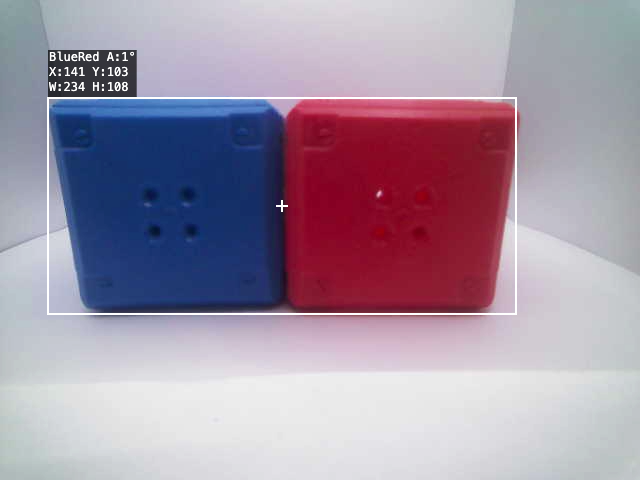 View of the video feed from the robot with the red and blue box close together and a box around them both indicating the color code is identified.