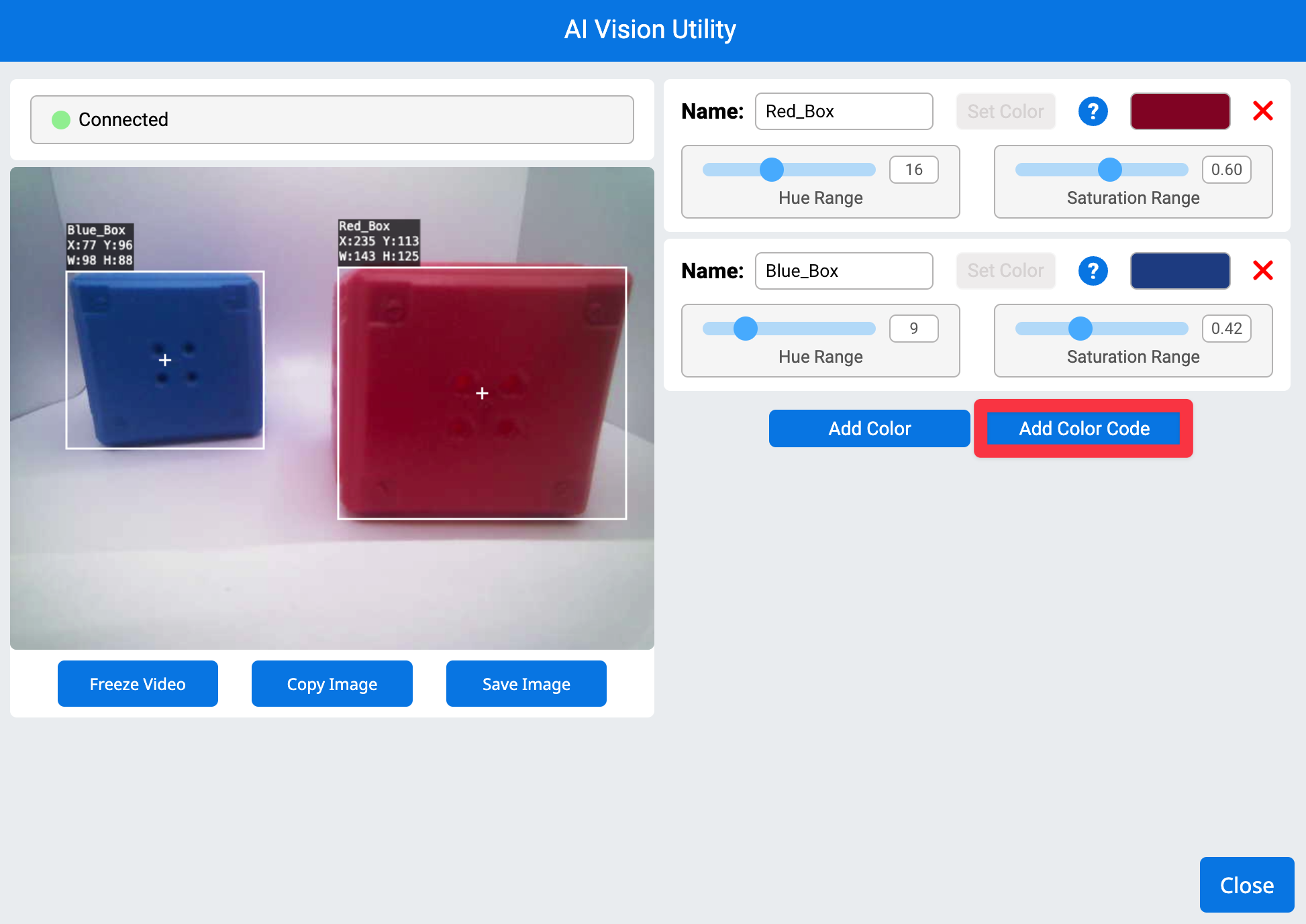 AI Vision Utility in VEXcode AIM. The left shows the camera feed from the robot with one blue cube and one red cube. The right has a highlight on the Add Color Code button.