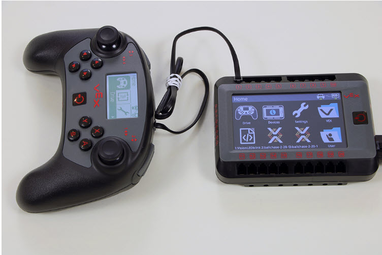 Image of a VEX V5 brain and controller, showcasing the components used for programming and controlling robotics in educational settings.