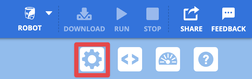 La esquina superior derecha de la barra de herramientas VEXCODE AIM con el botón del icono de engranaje resaltado en un cuadro rojo, que indica qué seleccionar para abrir el Panel de control.