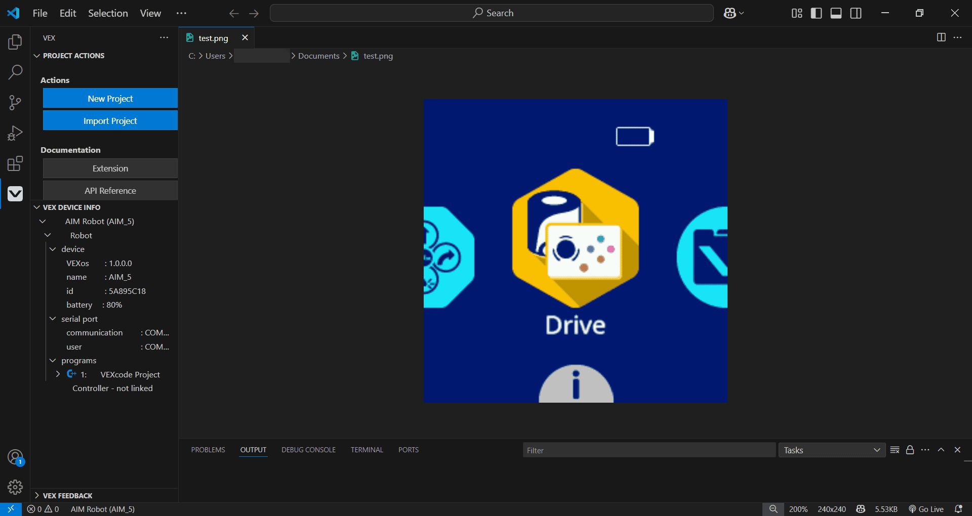 De Visual Studio Code-interface met de actieve VEX-extensie. In de zijbalk worden projectacties weergegeven, waaronder Nieuw project en Project importeren, documentatieopties en VEX-apparaatinfo voor een aangesloten AIM-robot. In het hoofdvenster is een afbeeldingsbestand met de naam test.png geopend. Hierin ziet u het Drive-pictogram uit het VEX GO Brain-menu, met daarboven een batterijpictogram.