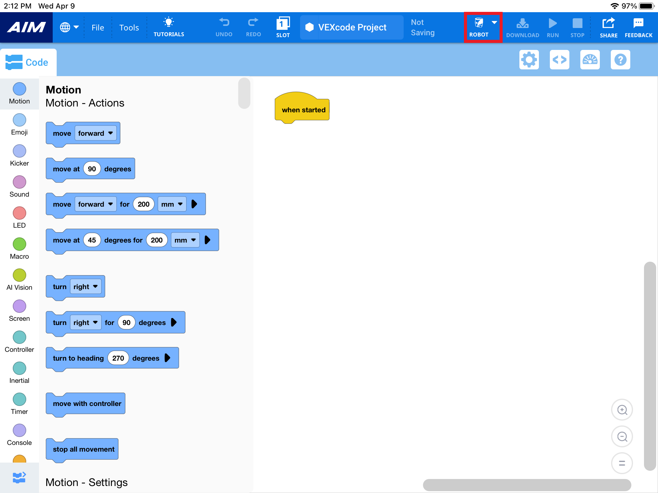 相同的 VEXcode AIM 介面，工具列中的機器人下拉按鈕以紅色突出顯示，位於工作區上方頂部中心附近。