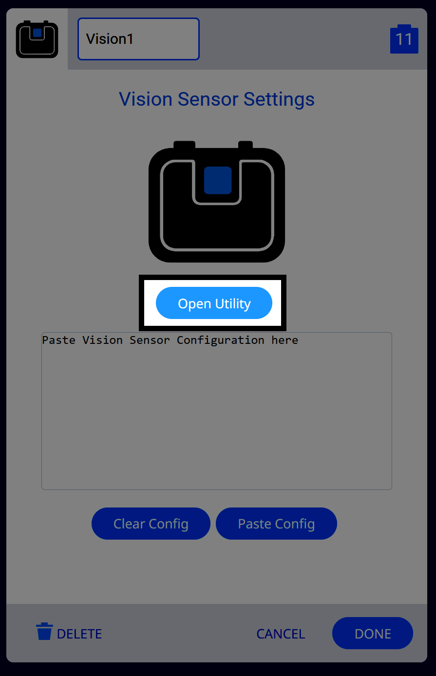 The Vision Sensor Settings panel in VEXcode EXP with the sensor labeled as Vision1. A large Vision Sensor icon is displayed, and beneath it, a blue button labeled Open Utility is highlighted with a white border. Below is a configuration text area for pasting sensor data, and buttons labeled Clear Config, Paste Config, Delete, Cancel, and Done.