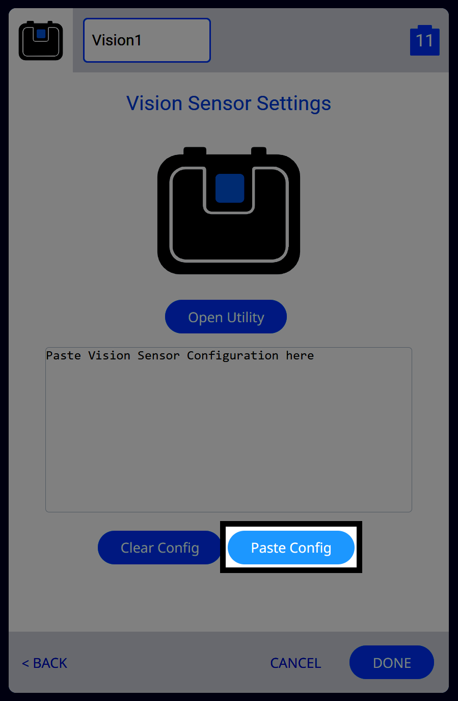 The Vision Sensor Settings screen within VEXcode shows a field labeled Paste Vision Sensor Configuration here. A blue button labeled Paste Config is highlighted below the empty text box. The sensor is labeled Vision1, and the Open Utility button is also visible.