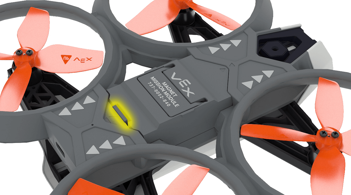 Angled view of the Mission Module port on the bottom of the Hornet. A small tab on the side of the port opposite the arrow is highlighted.