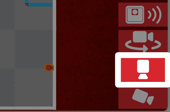 A close-up screenshot of the bottom right corner of the Playground Window, with the top camera button, a downward facing white camera icon, highlighted between the Orbit and Chase camera buttons.