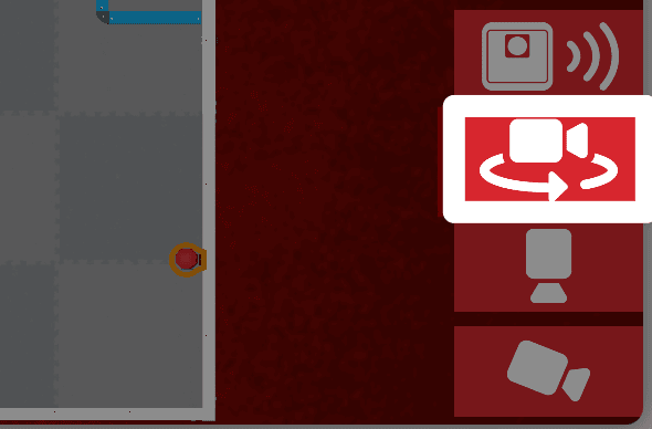 The same image as the one previous, with the orbit camera button, a white camera icon facing right with a curved arrow around it, highlighted, above the top camera.