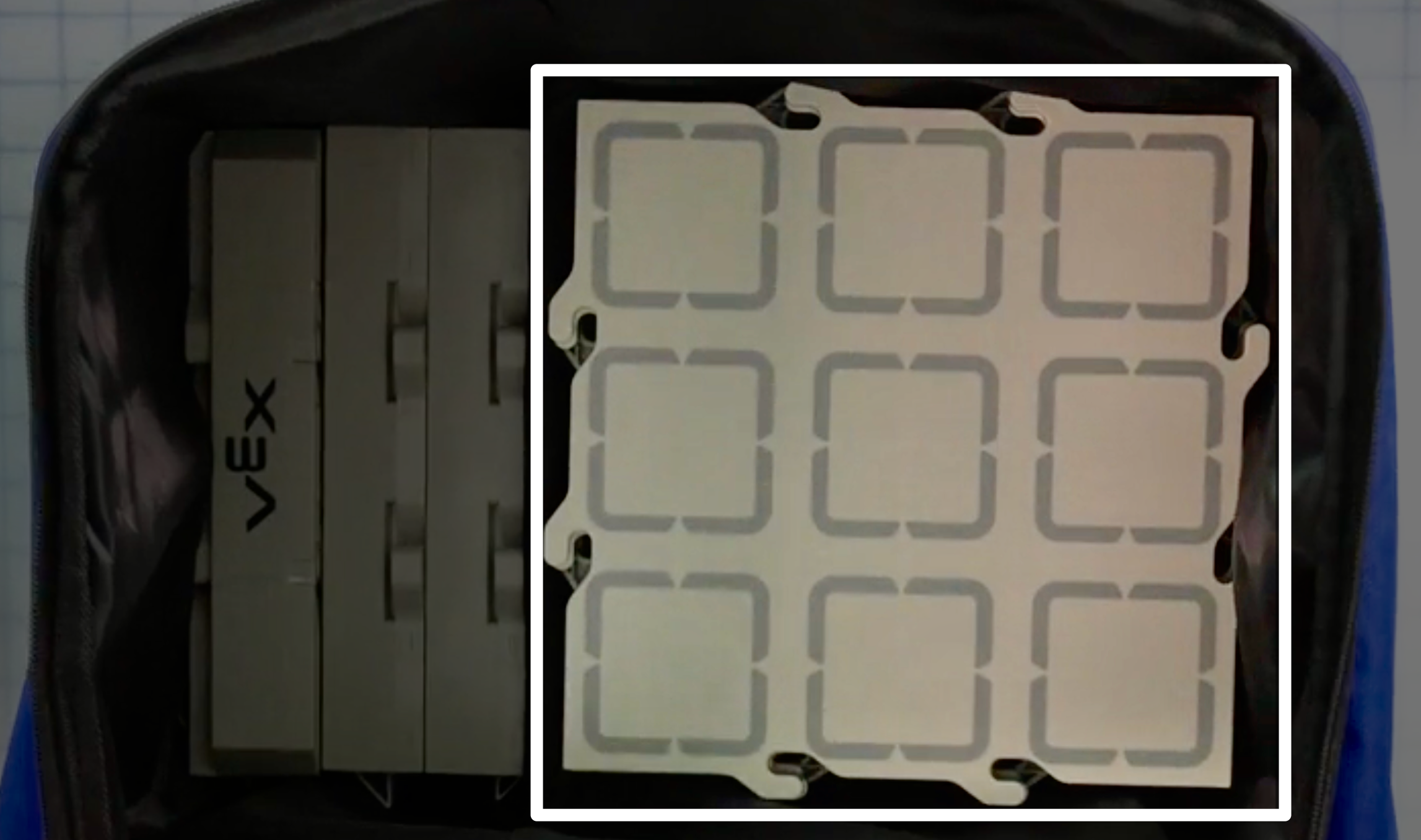 A top down view of the bundle bag with the AIM Robot Kits removed, highlighting the stack of Field tiles on the right hand side.