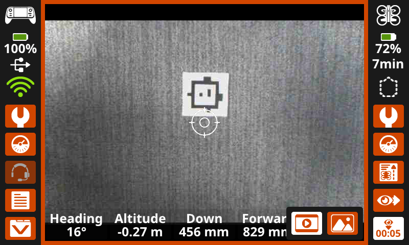 The same image as the one previous, showing the center display highlighted in an orange box, and a timer reading 5 seconds in the lower right corner, indicating a video is being recorded.