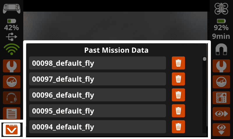 The Controller screen with the Past Mission Data window open and the button showing a V on a file folder in the lower right corner selected. Each mission is listed with a trash can icon to the right.