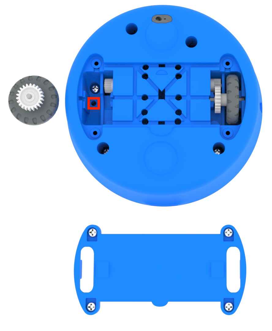 Unterseite eines 123-Roboters mit nach oben gerichtetem Augensensor, entfernter unterer Grundplatte und ebenfalls entferntem Rad auf der linken Seite. Hervorgehoben ist ein kleines Loch am tiefsten Teil der Radspur. Von diesem Winkel aus ist die Bohrung direkt in die Radspur ausgerichtet, also zur Oberseite des Roboters.