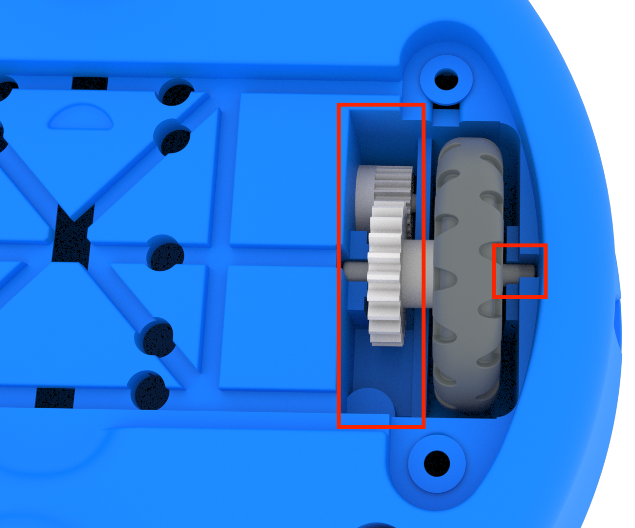 Parte inferiore di un robot 123 con una ruota rimessa nella sua sede. I rebbi della ruota si inseriscono in scanalature specifiche e l'ingranaggio sulla ruota deve trovarsi sullo stesso lato dell'ingranaggio nella pista.