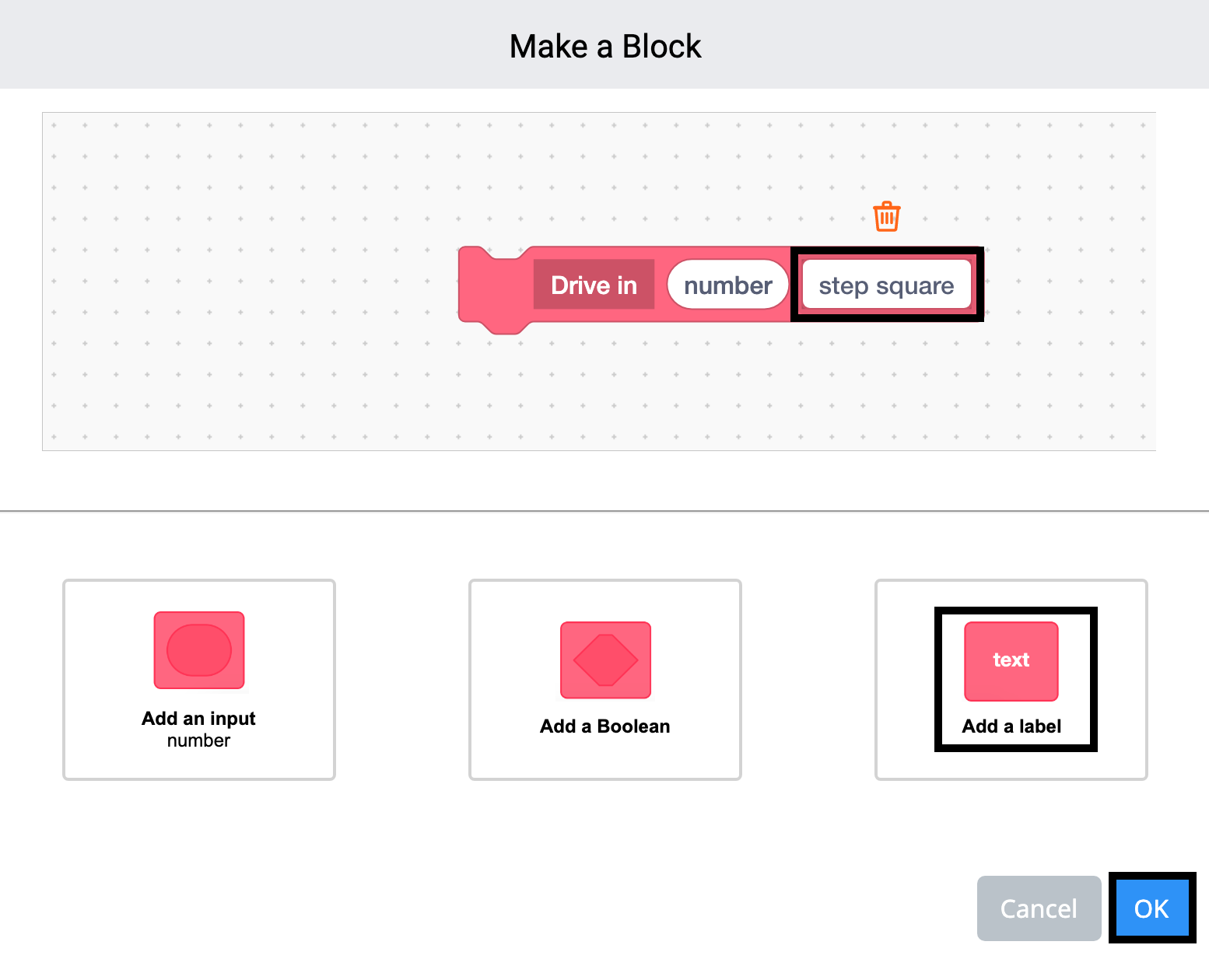 VEXcode 123 Make a Block মেনু খোলা আছে এবং ব্লকের নাম Drive in এ সেট করা আছে। ব্লকে একটি লেবেল ক্ষেত্র যোগ করা হয়েছে এবং এখন হাইলাইট করা হয়েছে।