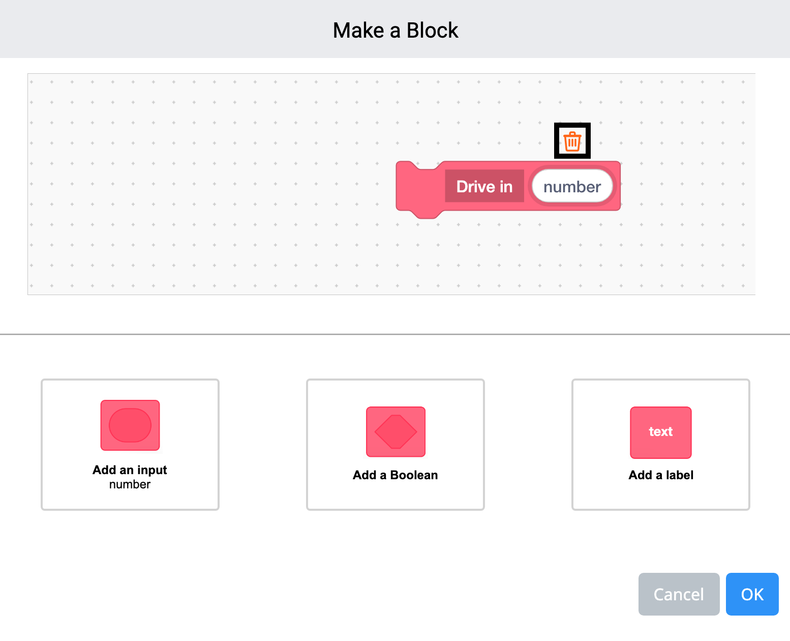VEXcode 123 ブロックの作成メニューが開き、ブロックの名前が Drive in に設定されています。 ブロックに数値入力フィールドが追加され、その上のクリア アイコンが強調表示されます。