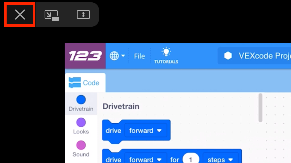 El video tutorial de introducción está abierto y en pantalla completa en una tableta, y hay un icono de salida en pantalla completa en la esquina superior izquierda que está resaltado.