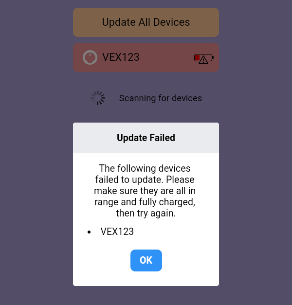Mensaje de error de la aplicación VEX Classroom que dice Actualización fallida, Los siguientes dispositivos no se actualizaron. Asegúrate de que todos estén dentro del rango y completamente cargados, e inténtalo de nuevo. El mensaje tiene una lista de cada robot que no se pudo actualizar y un botón azul Ok a continuación.
