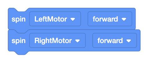 Divi VEXcode EXP Spin bloki, kas sastiprināti kopā kaudzē.