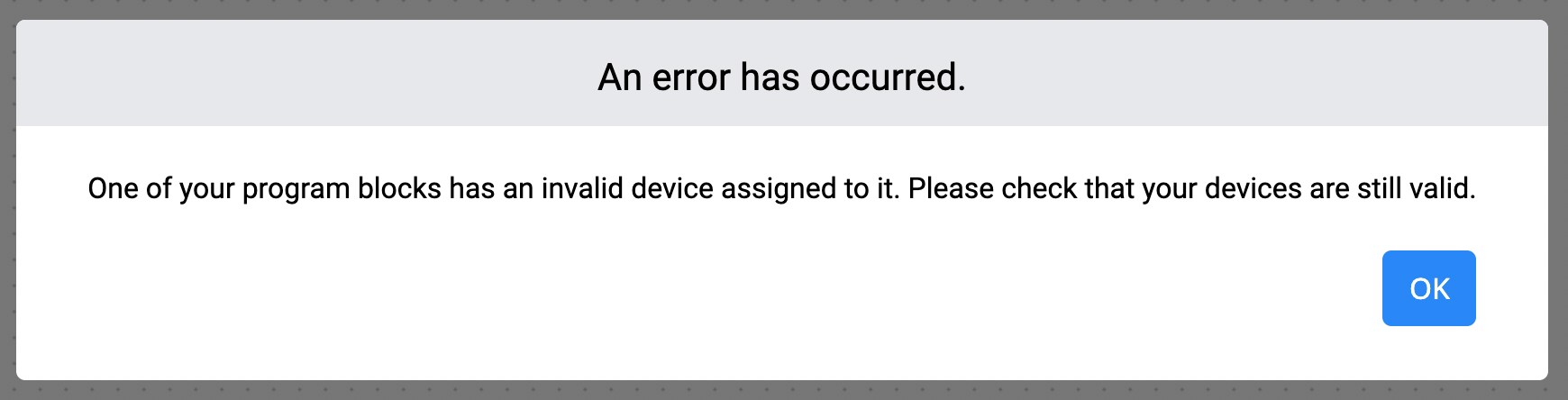 Výzva VEXcode EXP Error Occurred s textem Došlo k chybě. Jeden z vašich programových bloků má přiřazeno neplatné zařízení. Zkontrolujte prosím, zda jsou vaše zařízení stále platná. Dole je tlačítko OK.
