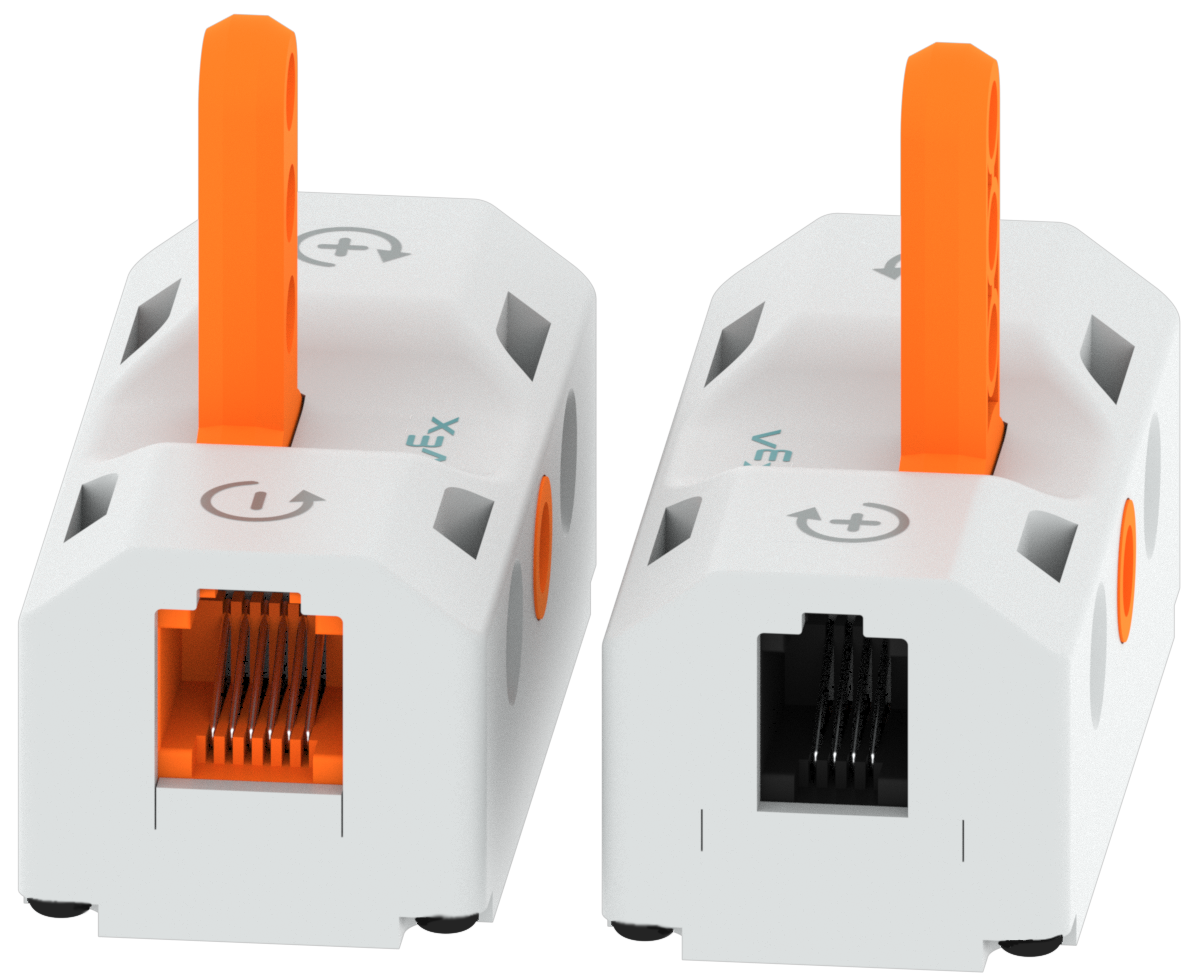 Peça do interruptor mostrada de ambos os lados para ilustrar que tem uma porta de cada lado. A Smart Port não é colorida e é mais pequena, enquanto a Battery Port é cor de laranja e maior.
