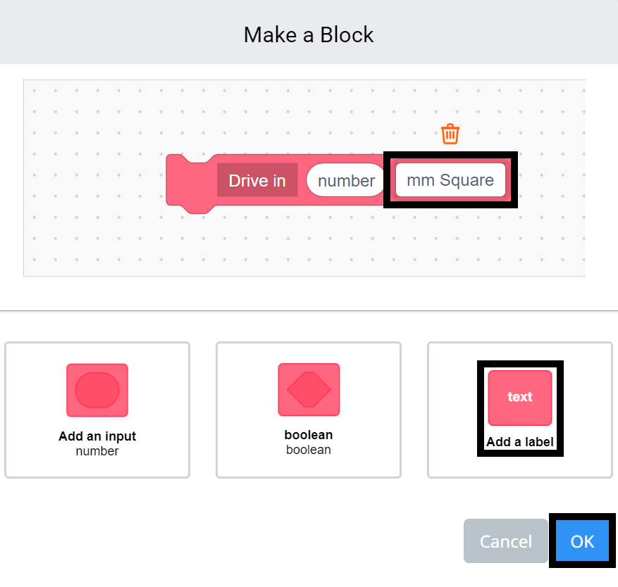 VEXcode GO Make a Block മെനു തുറന്നിരിക്കുന്നു, ബ്ലോക്കിന്റെ പേര് Drive in എന്ന് സജ്ജീകരിച്ചിരിക്കുന്നു. ബ്ലോക്കിലേക്ക് ഒരു ലേബൽ ഫീൽഡ് ചേർത്തിട്ടുണ്ട്, ഇപ്പോൾ അത് ഹൈലൈറ്റ് ചെയ്തിരിക്കുന്നു.