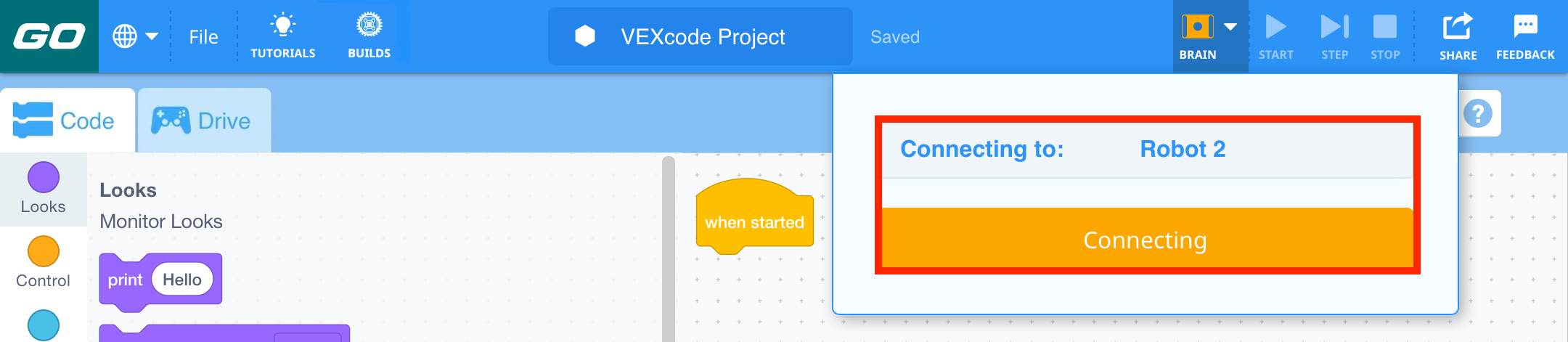 VEXcode GO ar oranžu Brain ikonu rīkjoslā, kas norāda, ka tiek izveidots savienojums.