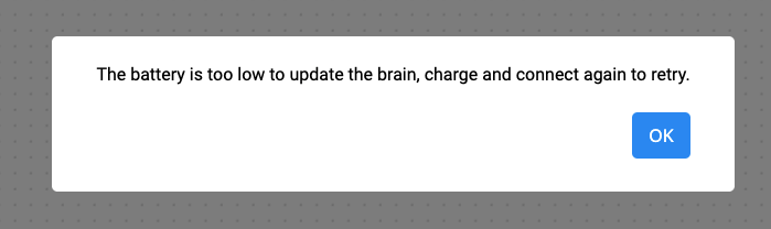 Aviso de batería baja de VEXcode GO que dice La batería está demasiado baja para actualizar el cerebro, cárguela y conéctese nuevamente para volver a intentarlo. El mensaje tiene un botón Aceptar debajo.