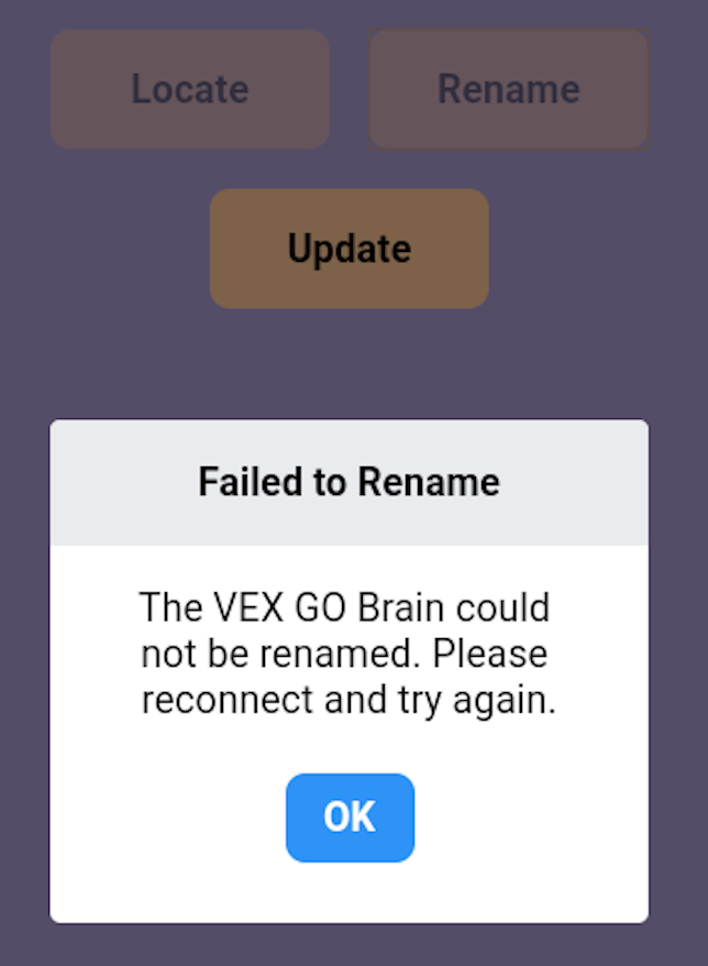 O pedido de erro da aplicação VEX Classroom diz Falha ao renomear. O VEX GO Brain não pôde ser renomeado. Volte a ligar-se e tente novamente. O aviso tem um botão azul Ok abaixo.