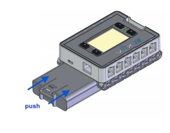 Het diagram toont een batterij die is aangesloten op een IQ Brain. Een pijl geeft aan dat de batterij in de oplaadpoort aan de onderkant van de Brain moet worden geplaatst. De batterij is zo geplaatst dat de vergrendeling van de hersenen af is gericht.