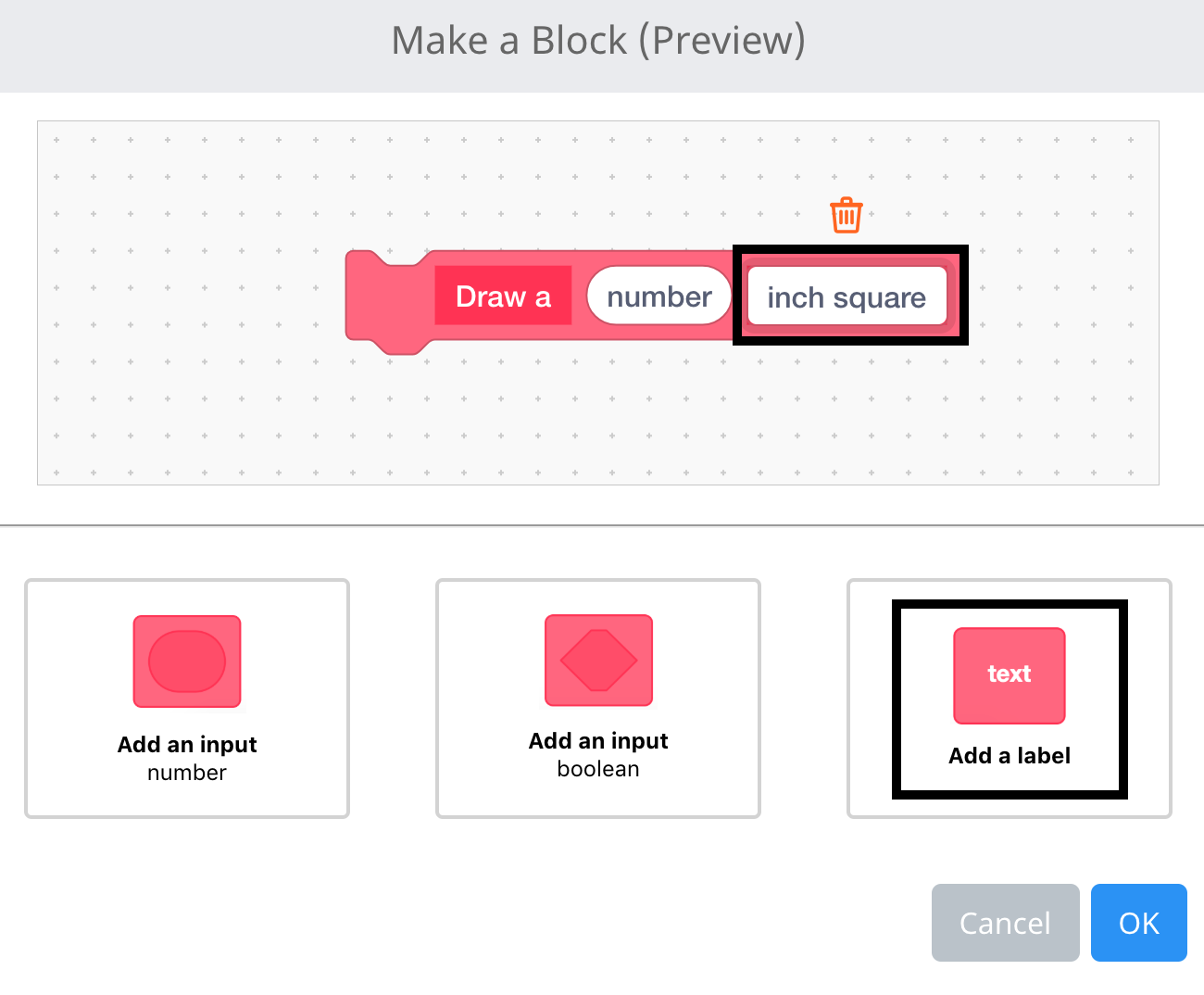 Das Menü „VEXcode IQ Block erstellen“ ist geöffnet und der Name des Blocks ist auf „Zeichnen“ gefolgt von einer Zahleneingabe eingestellt. Am Ende des Blocks wurde ein Beschriftungsfeld hinzugefügt, das nun hervorgehoben ist.