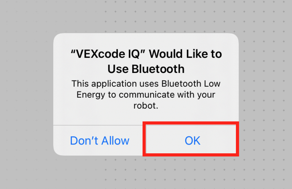 iPad の Bluetooth プロンプトに「VEXcode IQ Bluetooth を使用したいと思います」と表示されます。 このアプリケーションは、Bluetooth Low Energy を使用してロボットと通信します。 下に 2 つのボタンがあり、1 つは [許可しない]、もう 1 つは [OK] です。 [OK]ボタンが強調表示されます。