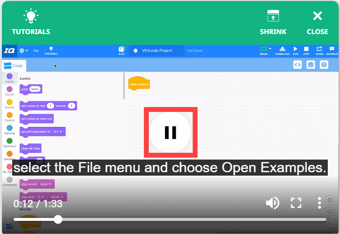 Video tutorial terbuka, dan ikon jeda video di tengah jendela disorot.