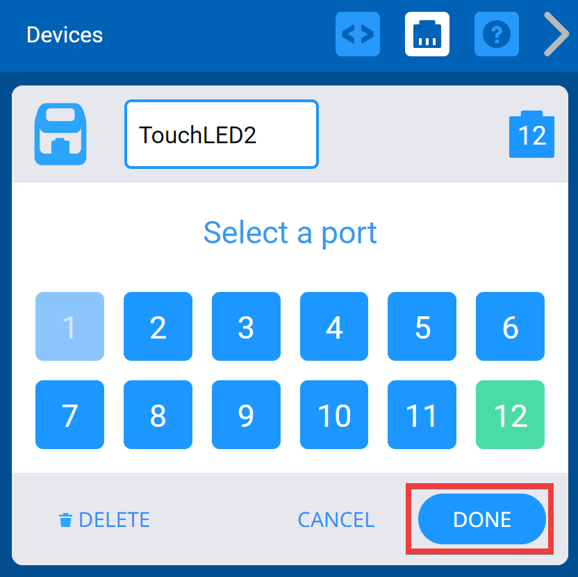 O menu de seleção de portas do dispositivo VEXcode IQ está a ser utilizado para alterar os números de porta já definidos. As portas selecionadas aparecerão a verde e, após selecionar as novas, o utilizador poderá clicar em Concluído para guardar as alterações.