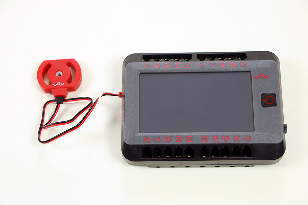 Diagram yang mengilustrasikan pengaturan dan koneksi sensor V5, menyoroti komponen utama dan fungsinya dalam sistem robotika.