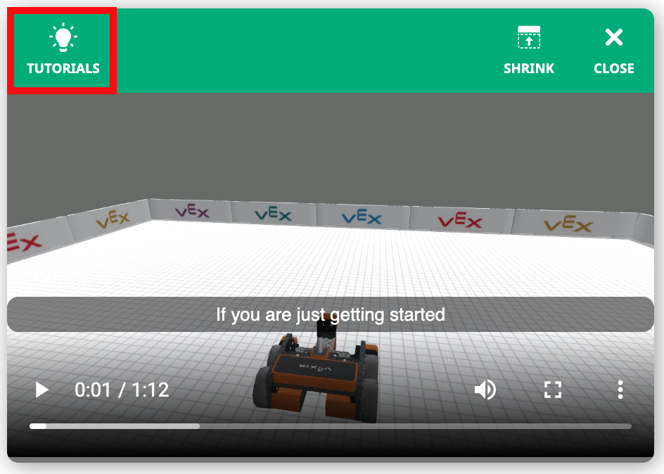 Botón de tutorial de VEXcode VR ubicado en la esquina de la interfaz, diseñado para ayudar a los usuarios a aprender conceptos de codificación a través de una simulación de robot virtual.