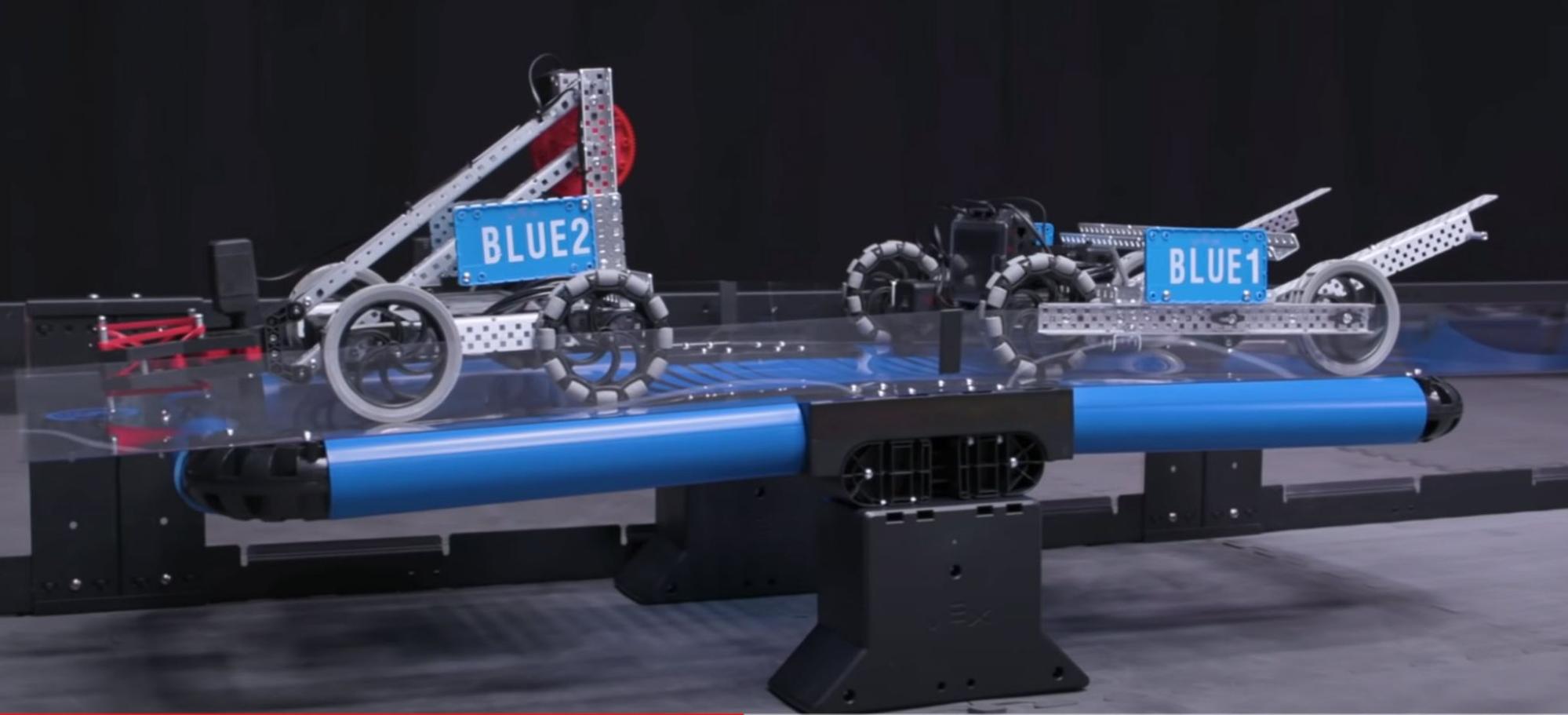 Schemat ilustrujący główne komponenty robota konkursowego V5, w tym silniki, czujniki i elementy konstrukcyjne, podkreślający konstrukcję i funkcjonalność niezbędne w konkursach robotyki.