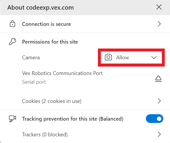 Microsoft Edge साइट सूचना ड्रॉपडाउन मेनू खुला है, जिसमें codeexp.vex.com वेबसाइट की सेटिंग्स दिखाई दे रही हैं। कैमरा विकल्प को अब 'अनुमति दें' में बदल दिया गया है।