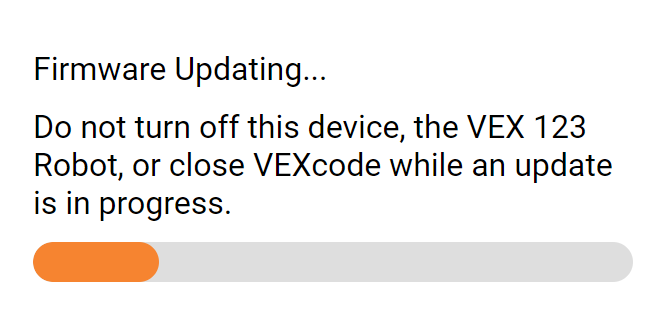 VEXcode 123 पॉप-अप विंडो जिसमें लिखा है 'फर्मवेयर अपडेट हो रहा है, अपडेट चालू होने के दौरान इस डिवाइस, VEX 123 रोबोट को बंद न करें या VEXcode को बंद न करें'।