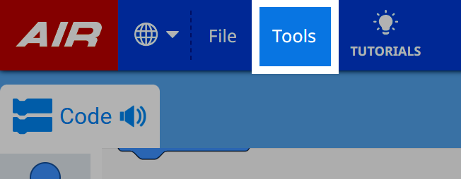 Barra de herramientas VEXcode con el logotipo de AIR a la izquierda y el menú Herramientas resaltado entre Archivo y Tutoriales; icono de globo también visible para la configuración de idioma.