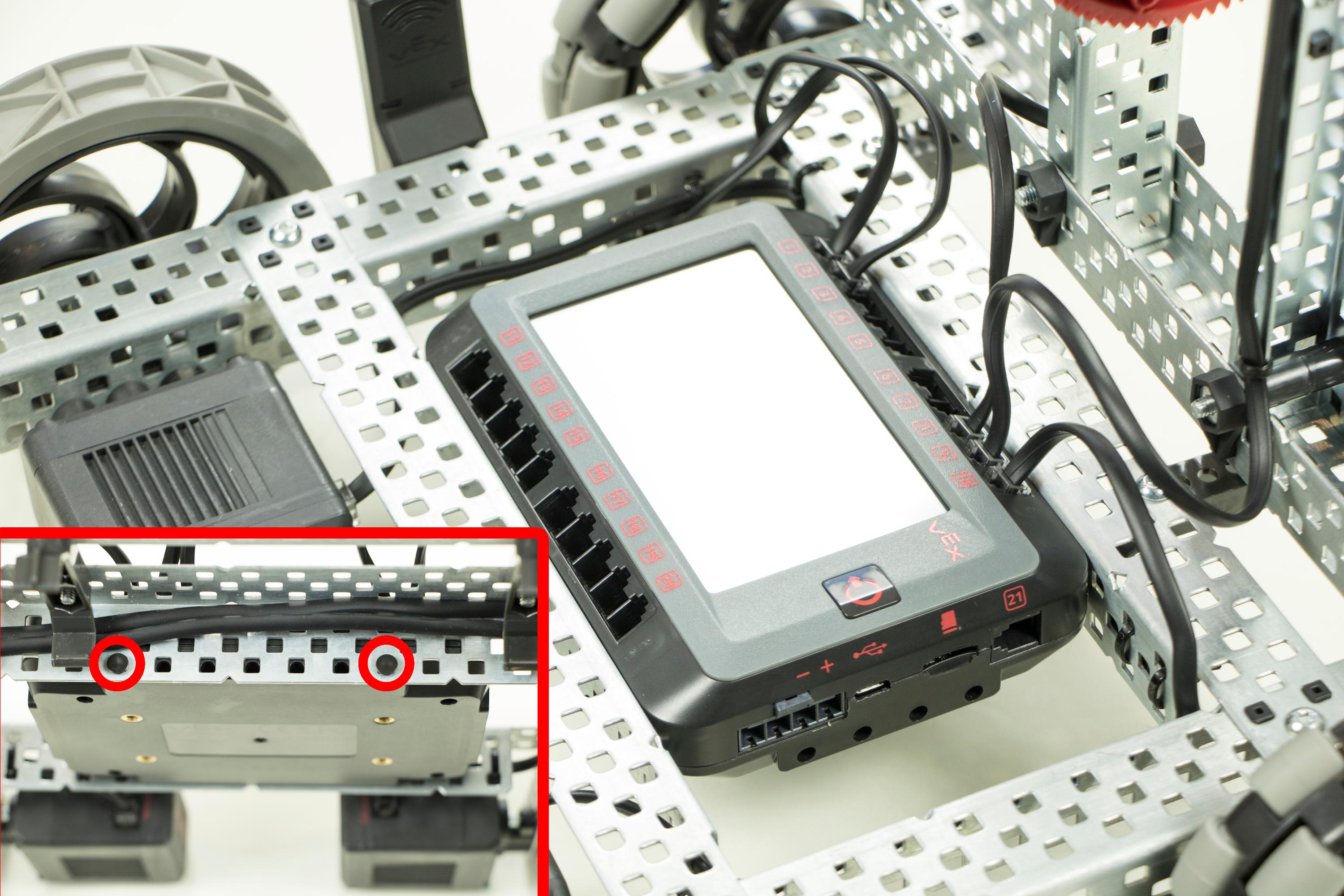 V5 Brain is shown mounted to the chassis. A diagram in the corner indicates that Connector Pins can be used to mount the V5 Brain using the holes on its side.