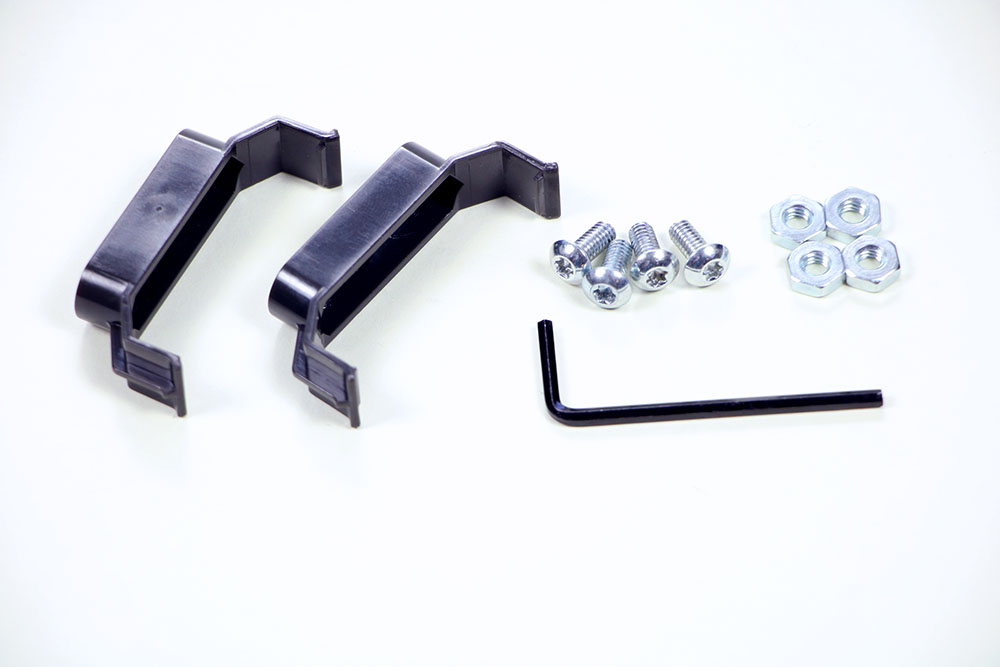 Pieces needed to mount the V5 Battery are placed together. The pieces shown include 2 V5 Battery Clips, 4 #8/32 Screws, 4 #8/32 Keps Nuts, and 1 Hex Key.