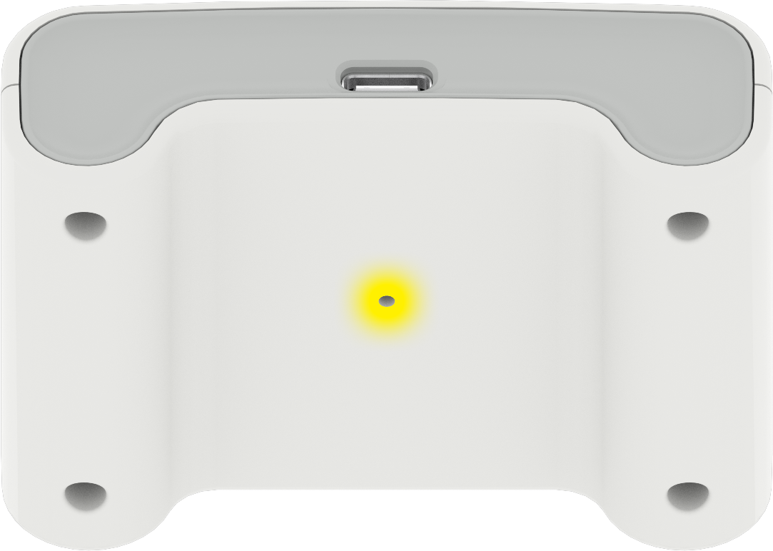 Ein Ein-Stick-Controller mit einem leuchtend gelben Licht in der Mitte auf der Rückseite.