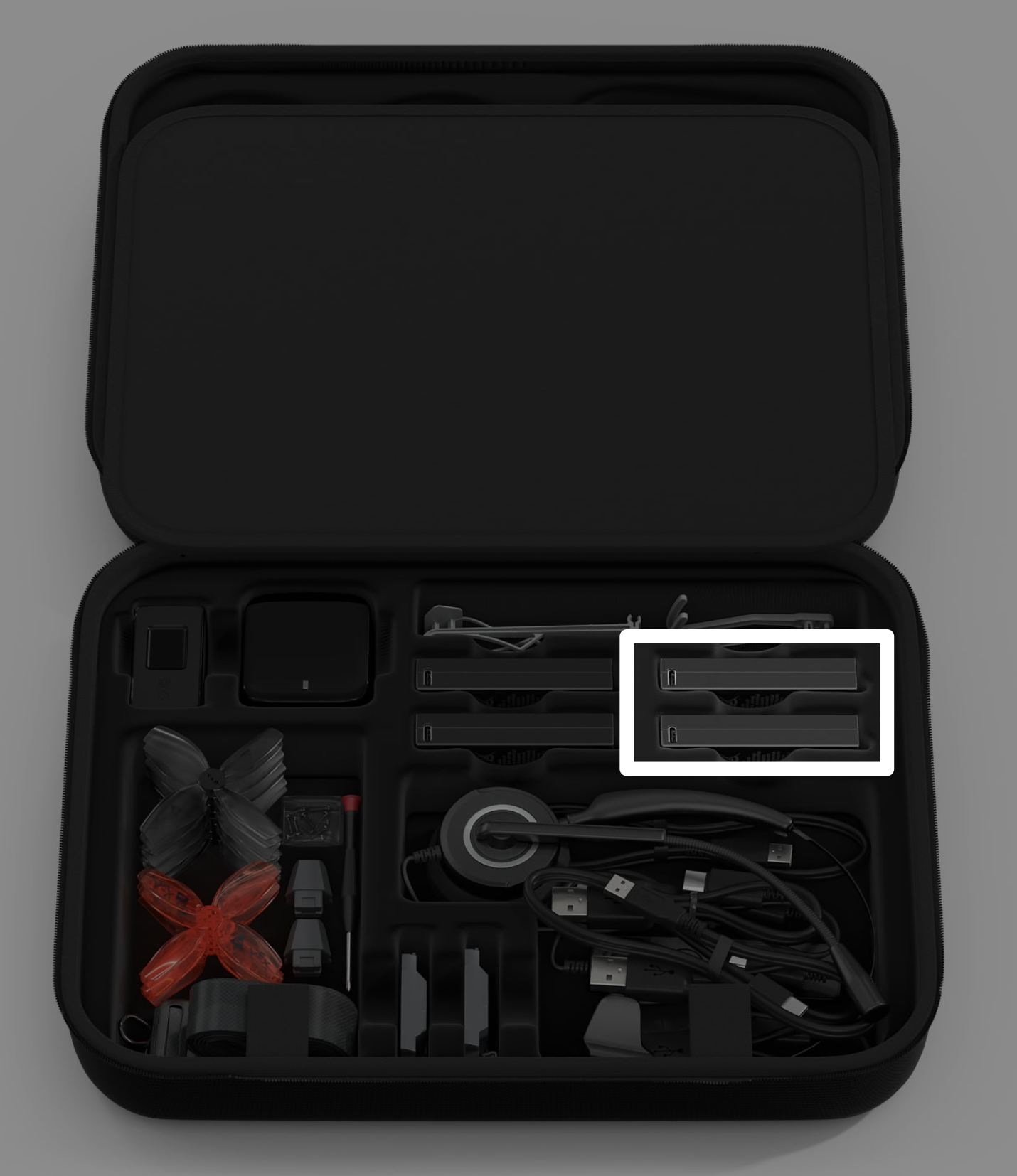 Estuche VEX AIR Drone Kit con una llamada en las 2 baterías a la derecha del estuche.