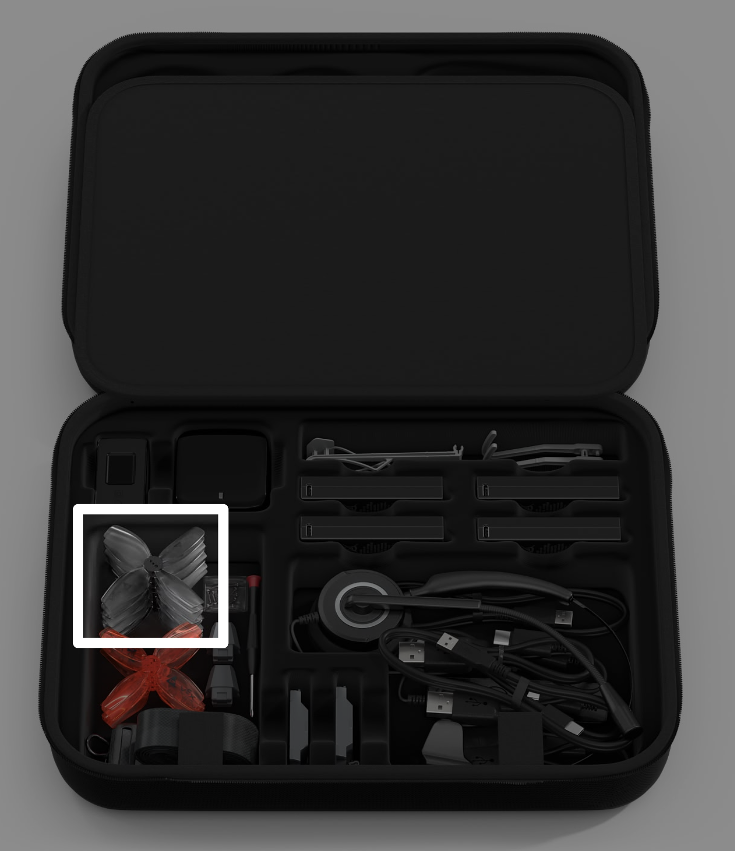 Estuche para kit de dron VEX AIR con una indicación de las hélices grises en el lado izquierdo del estuche.