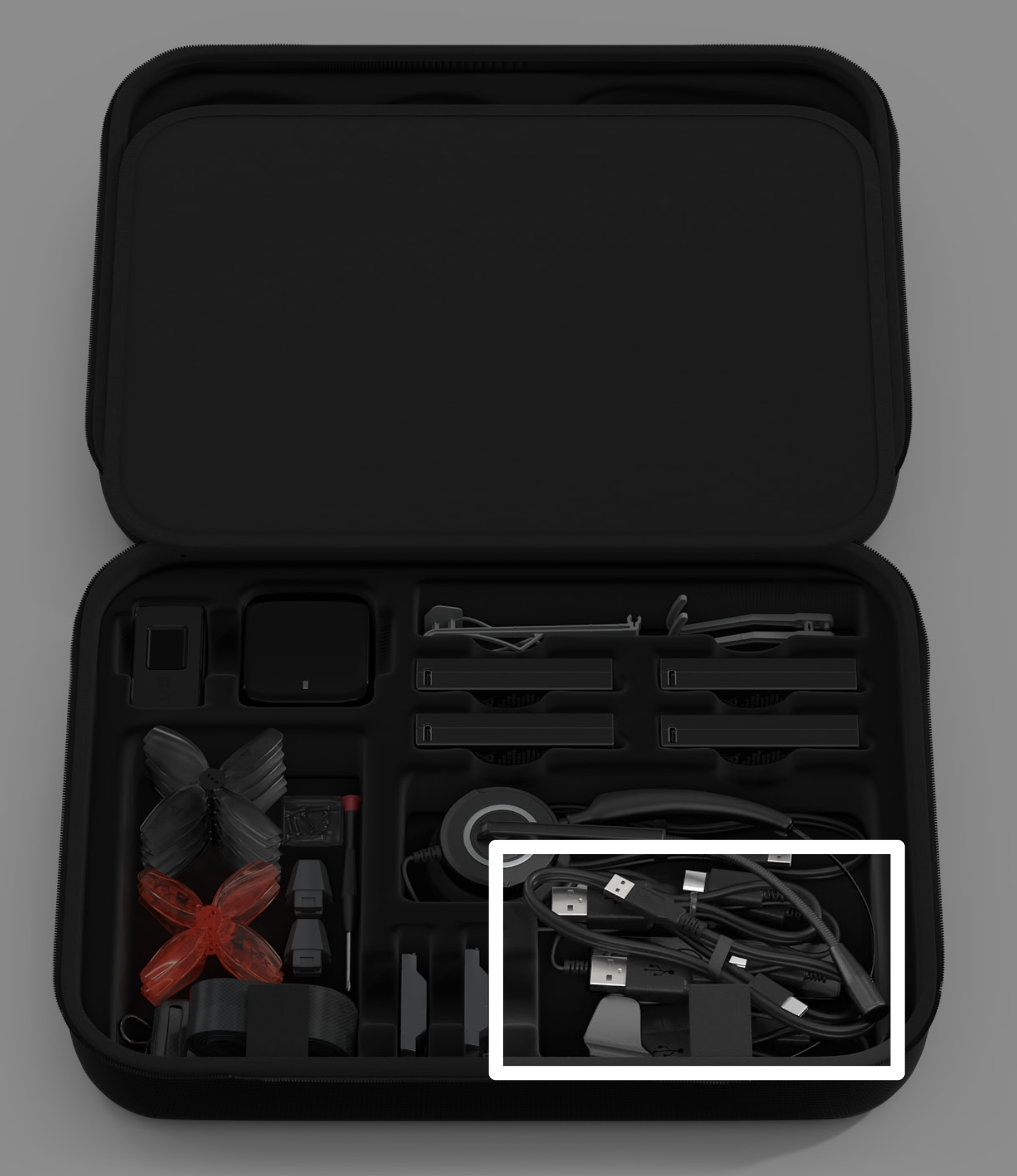 Estojo do kit do drone VEX AIR com indicação dos cabos USB na mesma secção direita onde está o headset.