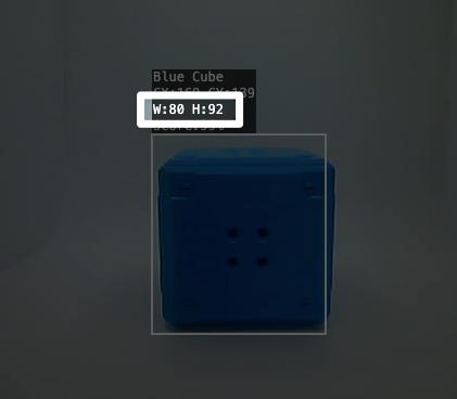 Tampilan dekat Blue Cube yang dideteksi oleh AI Vision di Utility. Sorotan menyoroti bagian teks di atas Kubus Biru yang bertuliskan W titik dua 80 H titik dua 92. Ini menunjukkan bahwa lebar kubus adalah 80 piksel dan tingginya 92 piksel.