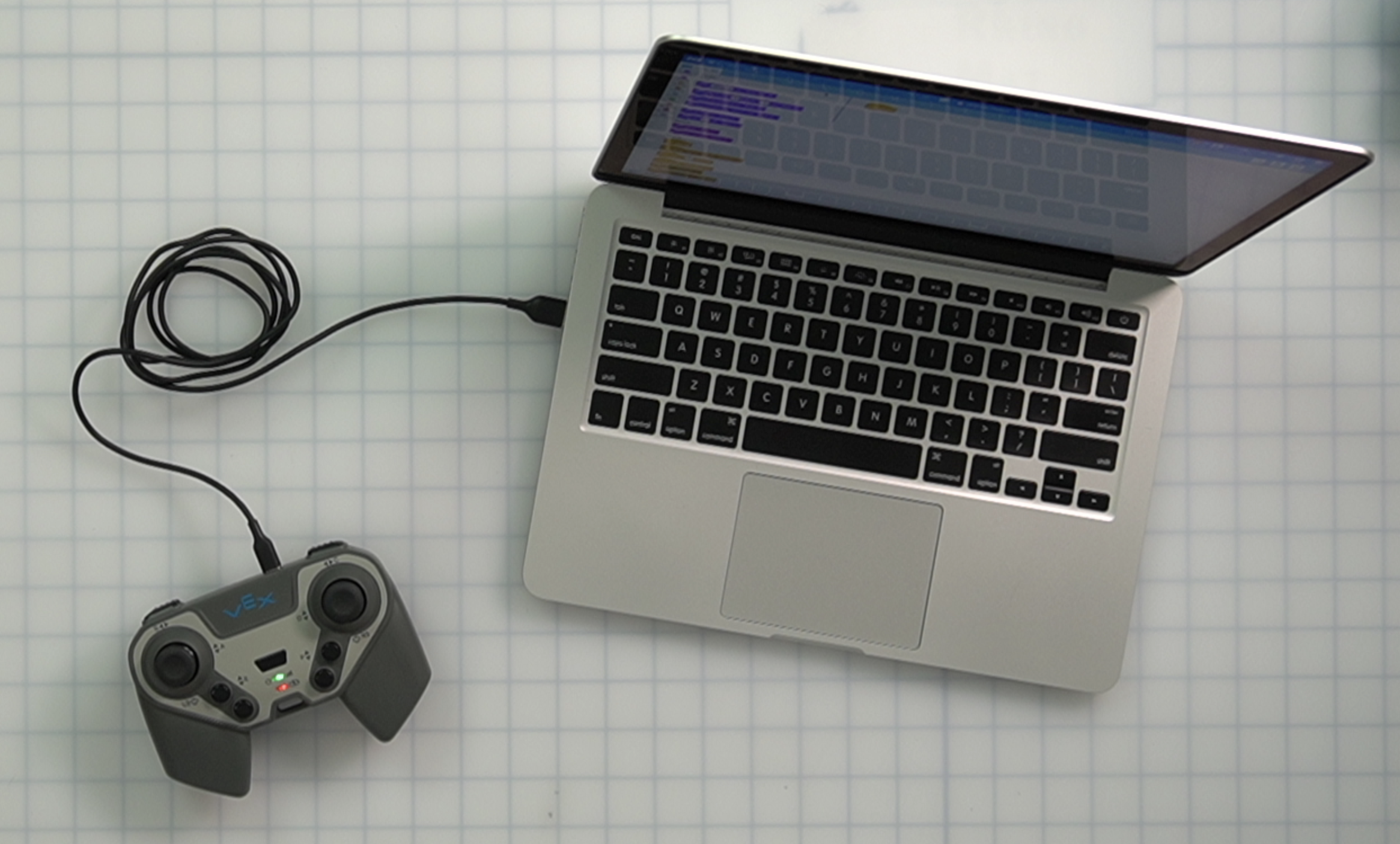 Controller connected to a laptop computer using a USB cable.
