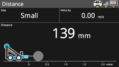 Brain screen is shown in the Distance Sensor menu that lists the sensor's data. The menu reports data of an object's size, velocity, and distance. The menu also has a diagram that visualizes the distance and how it changes over time. In this screenshot, the object's size is small, its velocity is 0 meters per second, and its distance is 139 mm.