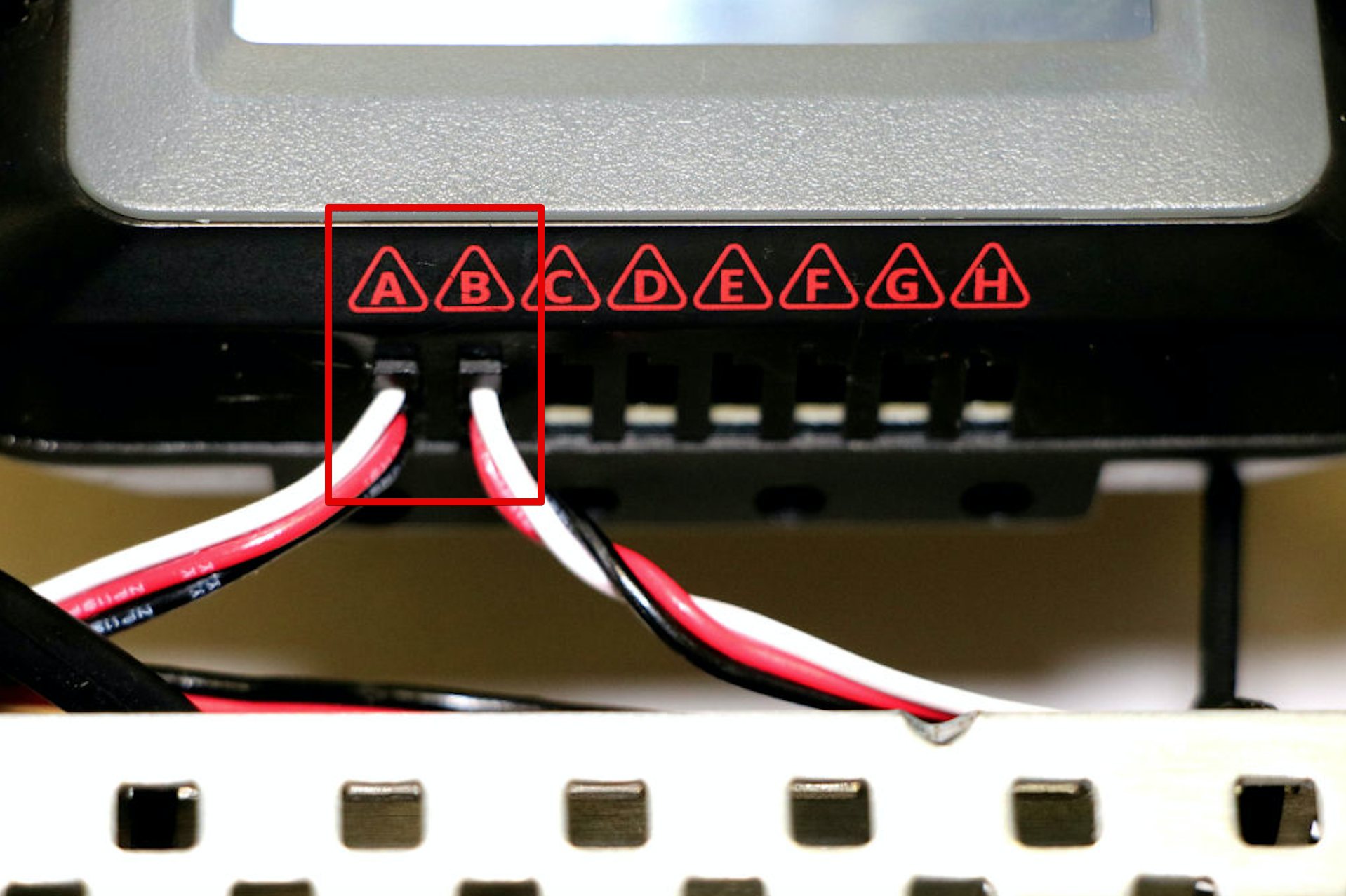 Close up view of the two Bumper Switch's wires connecting to the V5 Brain's 3-Wire ports. The left Bumper Switch's wire is in Port A and the right Bumper Switch's wire is in Port B.